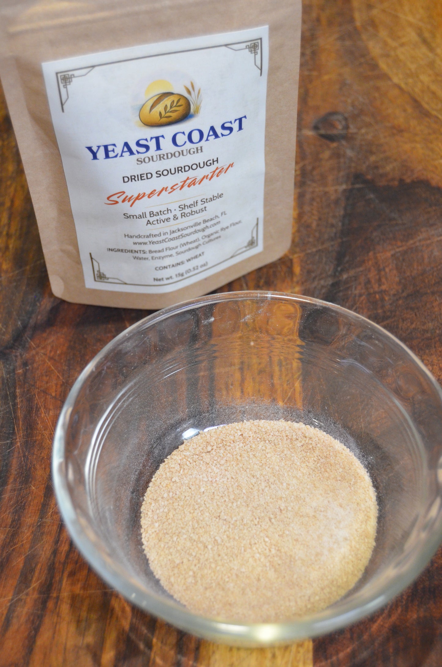 Yeast Coast Dried Sourdough Superstarter in a glass bowl on a wooden surface