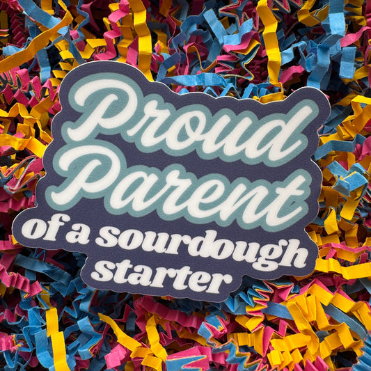 Sticker with 'Proud Parent of a sourdough starter' text on a colorful confetti background