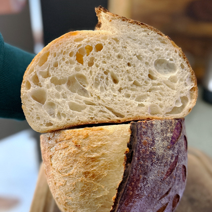 Close-up of a sliced loaf of bread with a blurred background